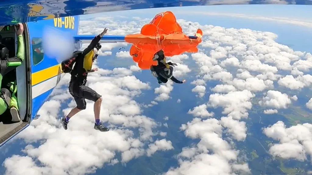 Skydiver gets stuck on plane wing, then...