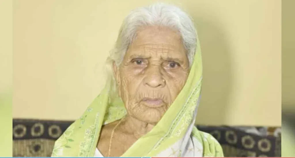 The old woman got up and cut the cake